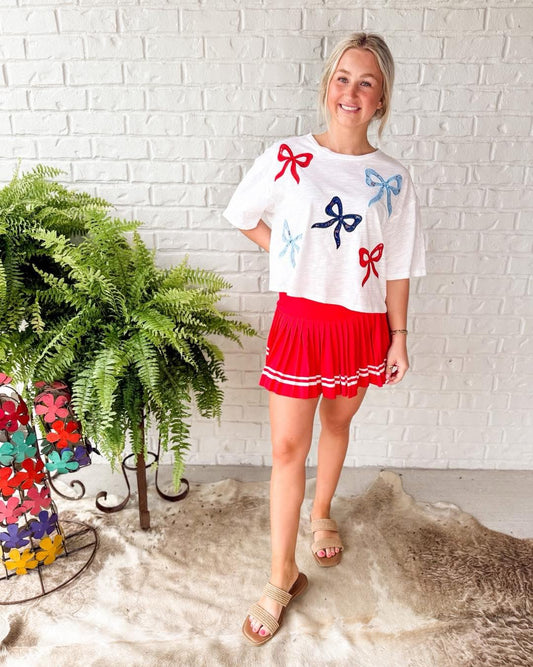 White top w red white blue bows