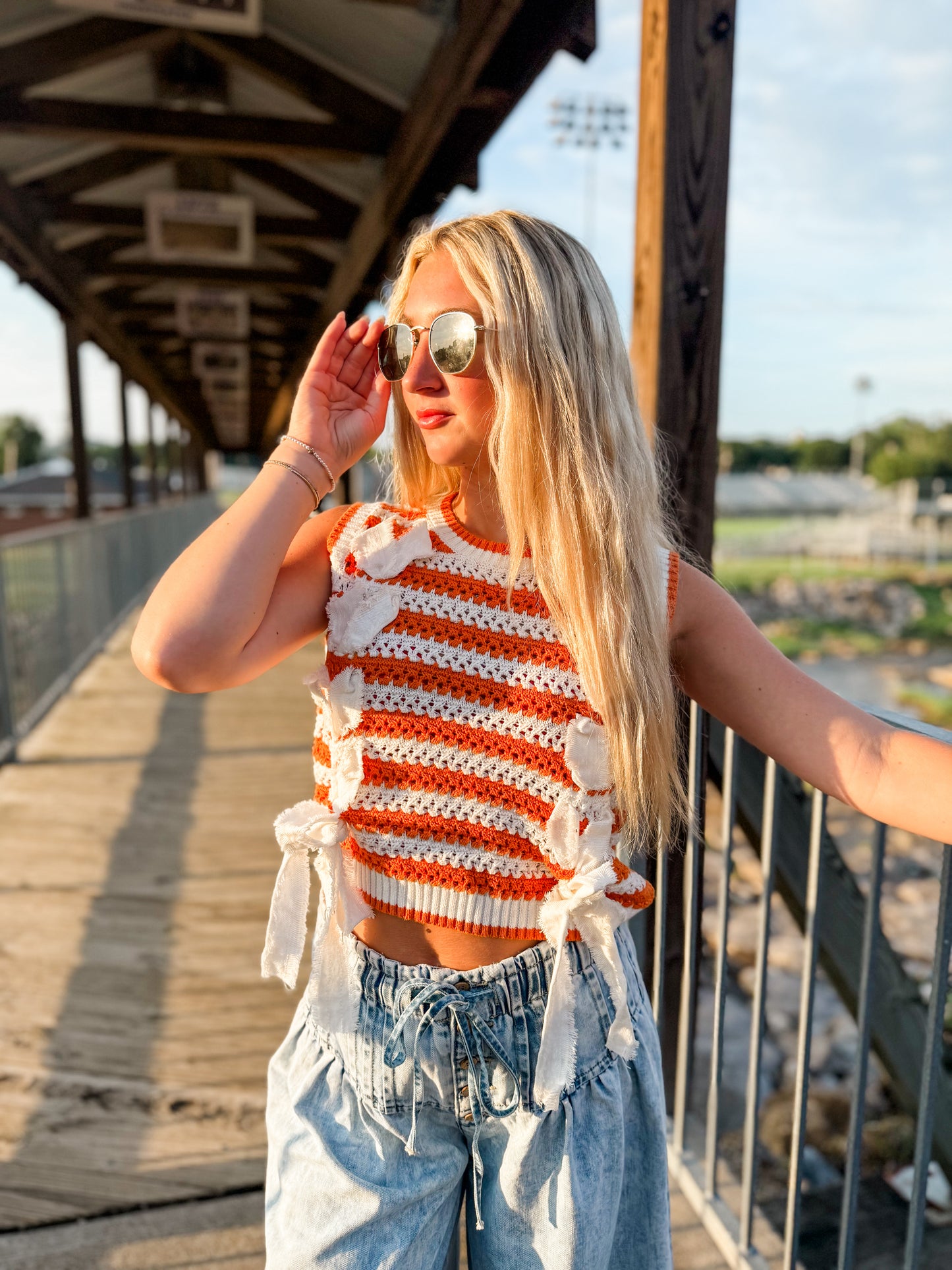 PL sleeveless sweater w bows orange and white